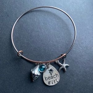 ⚠️ Silver toned bracelet with beach girl charm plus a shell and a starfish